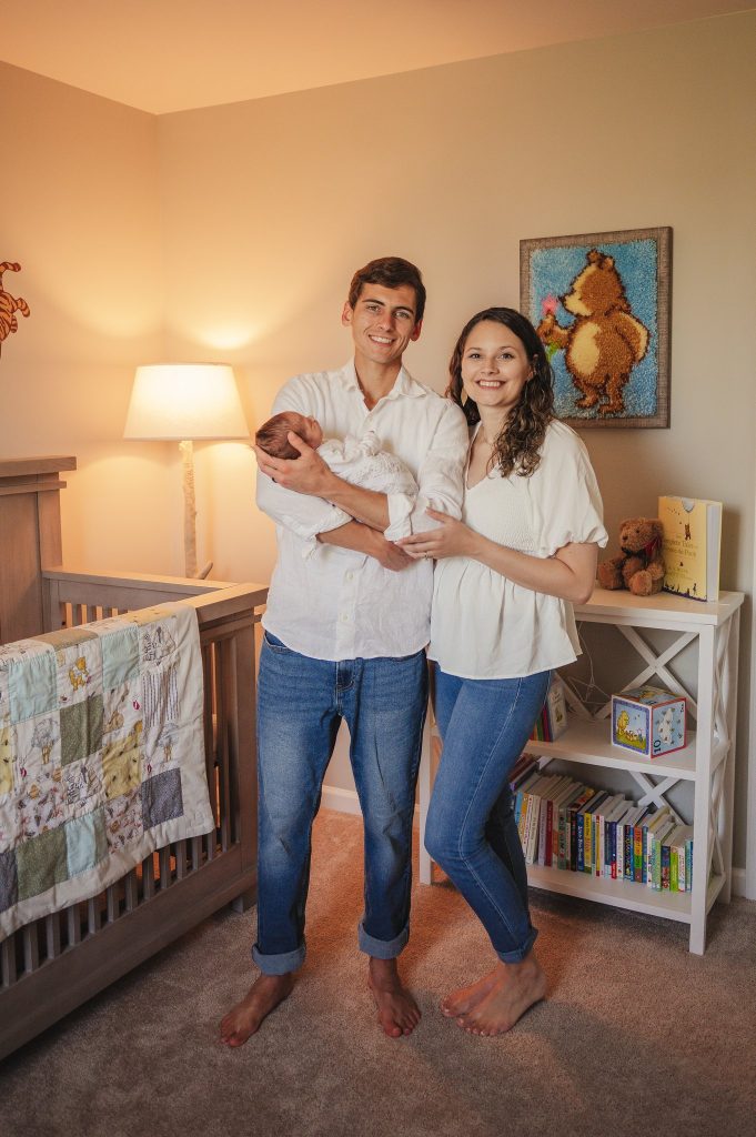 Family in Winnie the Pooh themed nursery