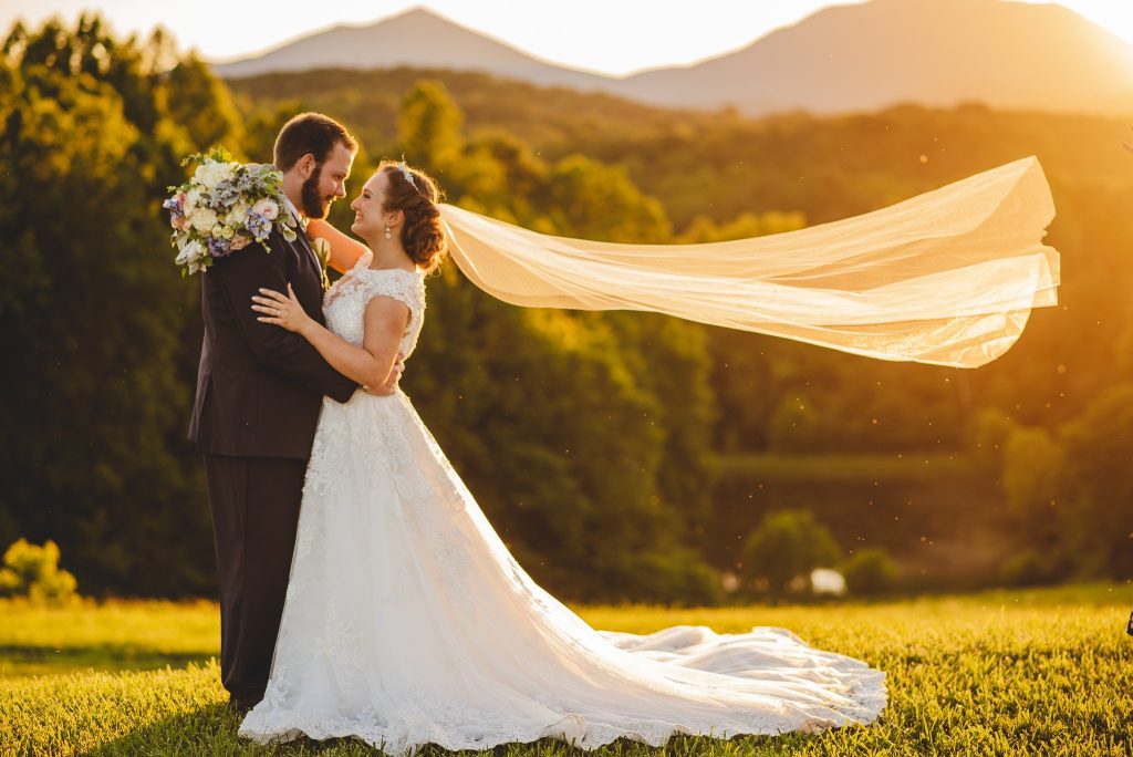 Bride and Groom at sunset with mountains