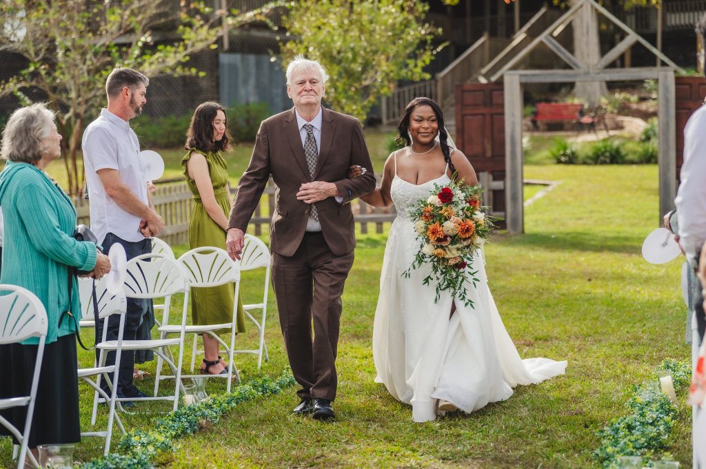 Bride walking down the aisle with father