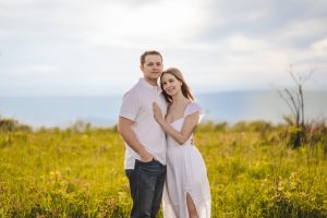 A couple wearing white in a field