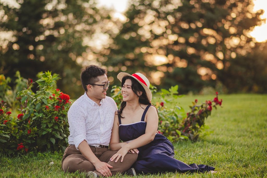 Couple sitting in a flower field