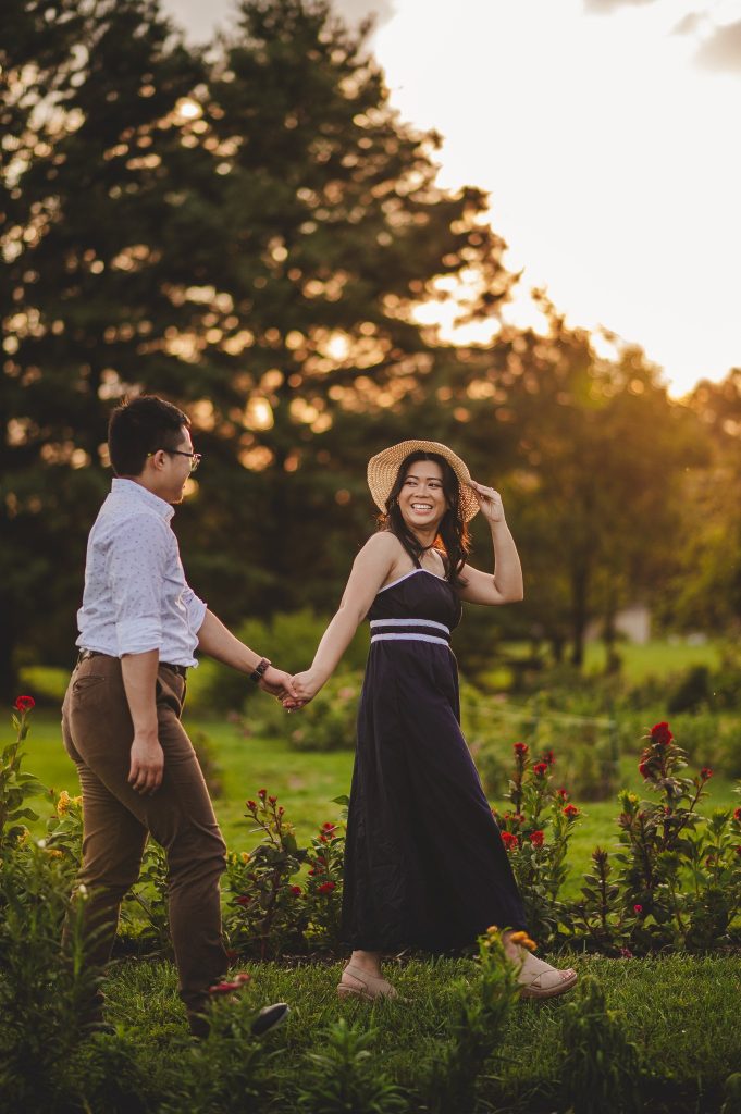 Man and woman frolic in a flower field