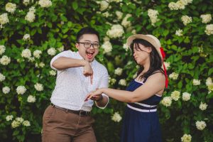 Man points at a woman's engagement ring