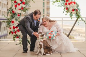 Shayna and Daniel pet their rescue dog