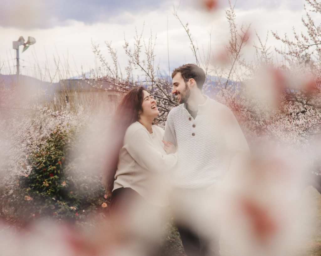 Couple admist plum blossoms